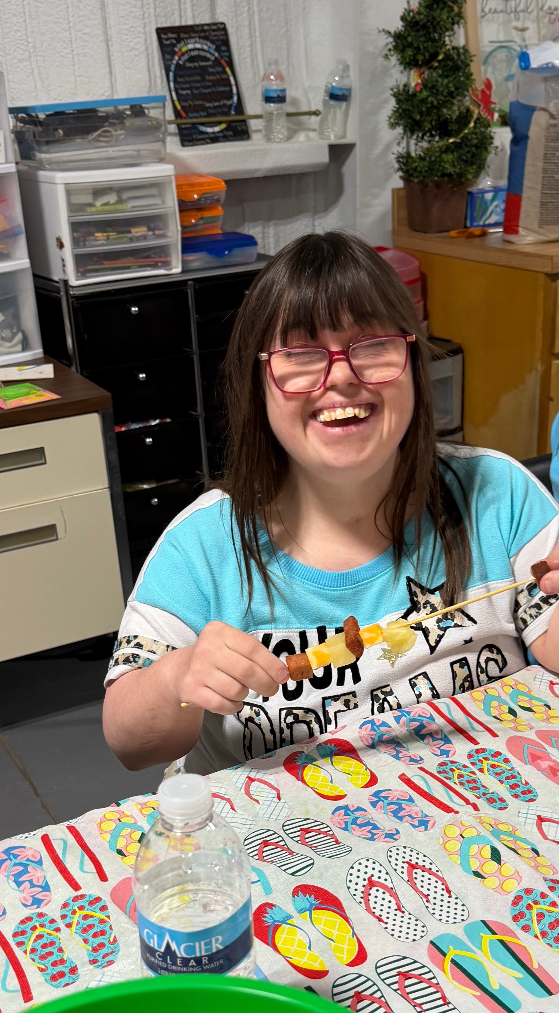 Alcove Care participant enjoying a fruit skewer activity